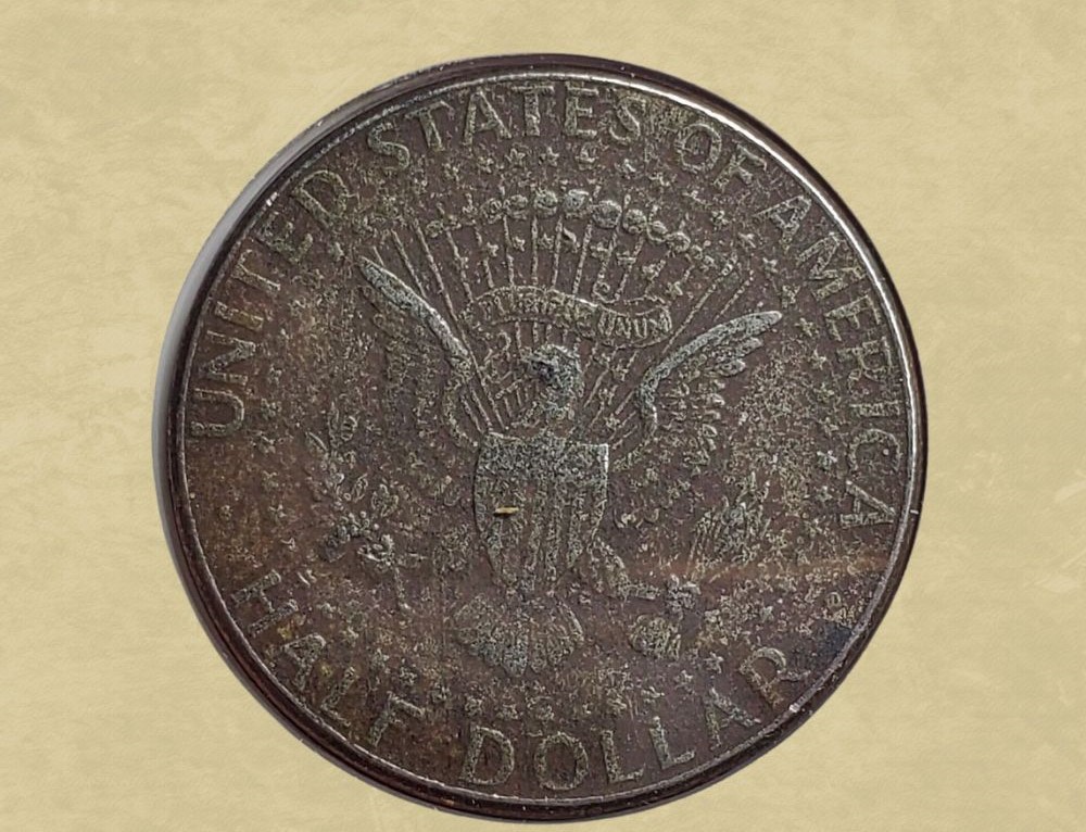 2021 Kennedy half dollar missing clad layer error showing exposed copper core on reverse
